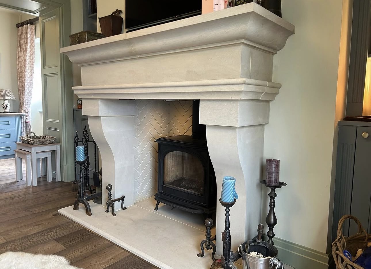 New stone fireplace and log burner in completed lounge